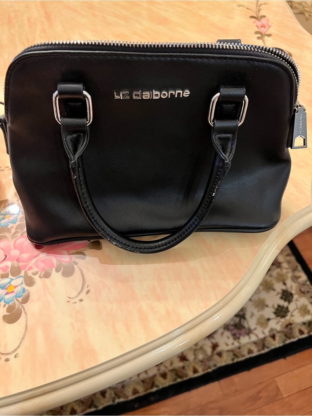 Liz Claiborne Black small bag hand bag clean and has enough pocket for items.